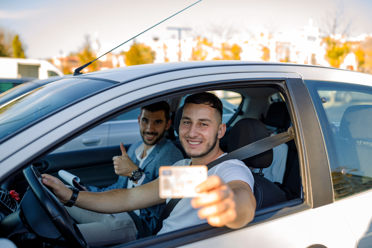 Young man that is a new driver on his first day with a license